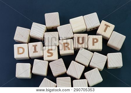 Business Disruption, Evolve Or Game Changer Concept, Straggle Cube Wooden Blocks With Some Combine T