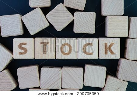 Stock Market, Equity Investment Asset Concept, Straggle Cube Wooden Blocks With Some Combine The Wor