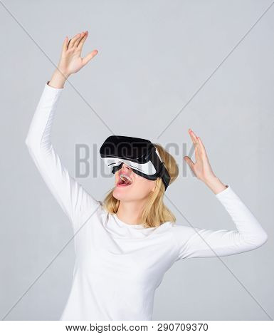 Portrait Of Young Woman Wearing Vr Goggles, Experiencing Virtual Reality Using 3d Headset. Happy Wom