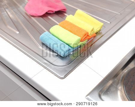 Colorful Table Cloths On The Spotless Stainless Surface Of A Kitchen Table