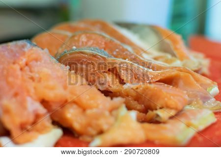 Slicing Of Pink Salmon With Salt On Cutting Board Closeup Natural