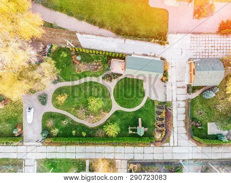 Aerial Drone View Of Backyard Garden With Circle Wath Path, Green Grass Lawn And Trees. Landscape De