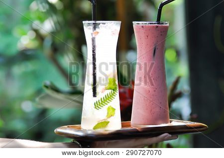 Serving Strawberry Yogurt Smoothie And Itlian Soda Or Lemon Juice