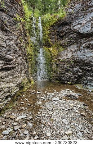 Little Waterfall In Green Summer Mountains, Norway.