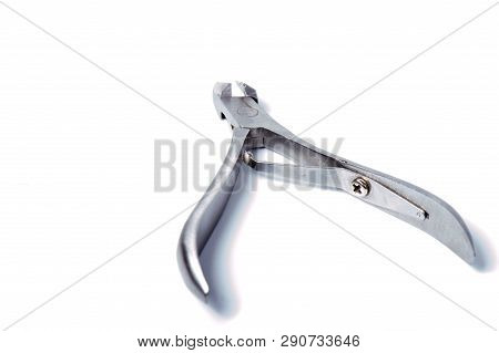Nail Clippers To Remove The Cuticle And Nail Care Products On A Light Background.