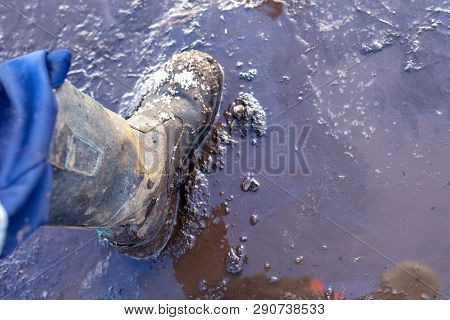 Legs In Boots, Go Through The Mud And Puddles. Workmans Boots