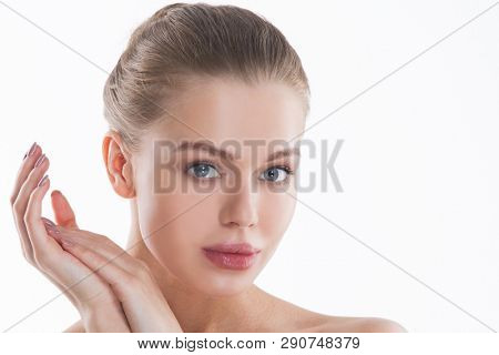 Perfect female face and hands closeup . Healthy Woman . Facial treatment and cosmetology concept