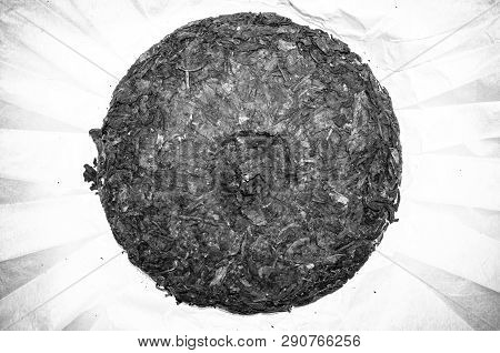 Chinese Pressed Puer Tea On Wrapping Paper, Close-up, Macro