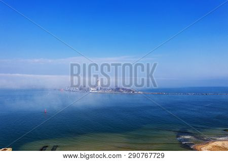 Aerial View Of Panoramic Seaport Warehouse And Container Ship, Crane Vessel Working For Delivery Of