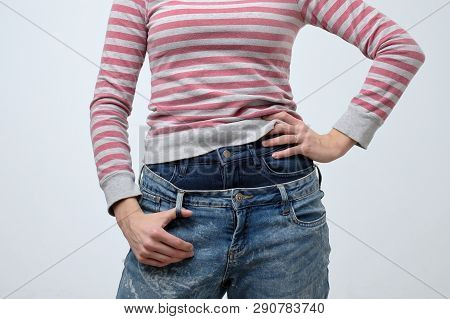 Woman Wearing Two Jeans Pants. Strange And Odd Fashion. She Is Very Sloppy