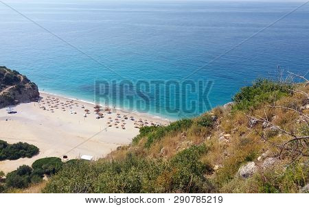 Summer Albania Beach View. Ionian And Adriatic Sea. Seashore With Wave Sand Rock Stone Sky And Sun. 