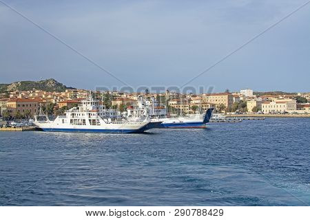Isola Maddalena, Sardinia, Italy - March 7, 2019: Ferries Moored In Port In La Maddalena On A Sunny 