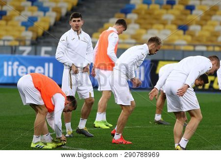 Kyiv, Ukraine - March 18, 2019: Players Stretch During The Open Training Session Of Ukraine National