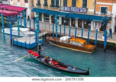 Venice / Italy 19 February 2019 : Gondol In The Grand Canal ,tradiotional Transportation Of Venice