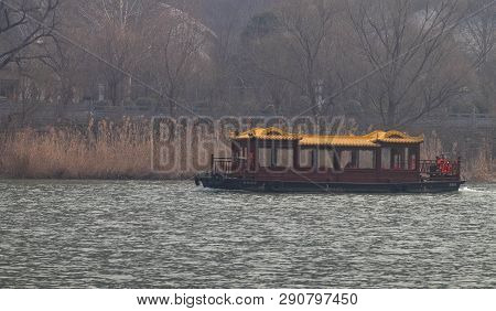 Luoyang, Henan/china- January 19, 2019: The Boat For Traveler Across The  Yi River At The Longmen Gr