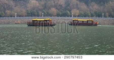 Luoyang, Henan/china- January 19, 2019: The Boat For Traveler Across The  Yi River At The Longmen Gr