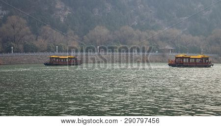 Luoyang, Henan/china- January 19, 2019: The Boat For Traveler Across The  Yi River At The Longmen Gr