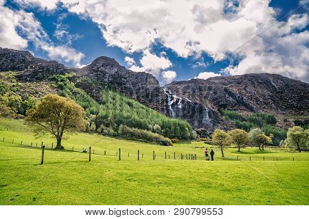Beautiful Landscape With Two Hikers In  Gleninchaquin Park. Kenmare, County Cork, Ireland.