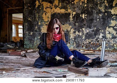 Girl In A Black Cloak With A Diplomat And Money In A Ruined Room. A Spy In A Secret Meeting. Unusual
