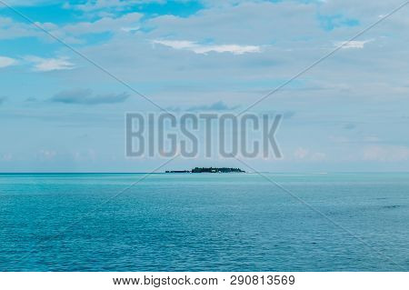 Maldives Background. Sunset Over The Tropical Sea And Coral Beach With Colorful Clouds In The Sky. B