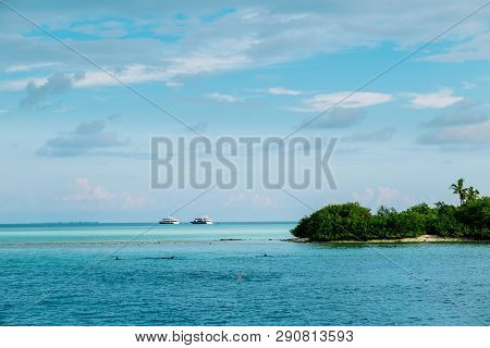 Maldives Background. Sunset Over The Tropical Sea And Coral Beach With Colorful Clouds In The Sky. B