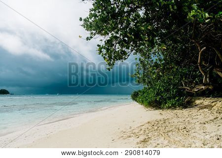 Maldives Background. Sunset Over The Tropical Sea And Coral Beach With Colorful Clouds In The Sky. B