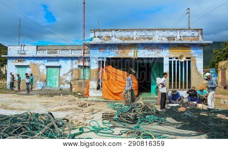 Fishermen Working With Fishing Nets
