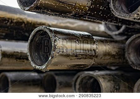 Oil Drill Pipe. Rusty Drill Pipes Were Drilled In The Well Section. Downhole Drilling Rig. Laying Th