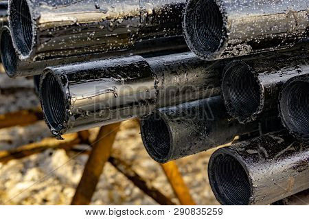 Oil Drill Pipe. Rusty Drill Pipes Were Drilled In The Well Section. Downhole Drilling Rig. Laying Th