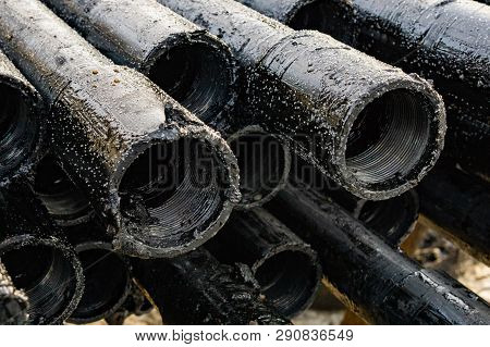 Oil Drill Pipe. Rusty Drill Pipes Were Drilled In The Well Section. Downhole Drilling Rig. Laying Th