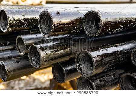 Oil Drill Pipe. Rusty Drill Pipes Were Drilled In The Well Section. Downhole Drilling Rig. Laying Th