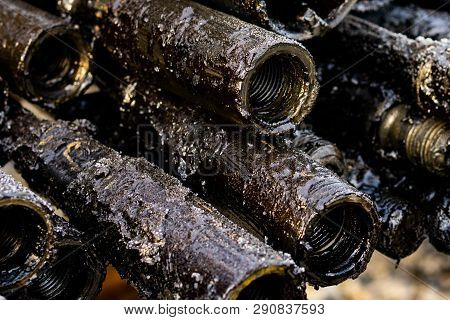 Oil Drill Pipe. Rusty Drill Pipes Were Drilled In The Well Section. Downhole Drilling Rig. Laying Th