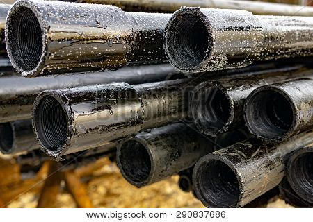Oil Drill Pipe. Rusty Drill Pipes Were Drilled In The Well Section. Downhole Drilling Rig. Laying Th
