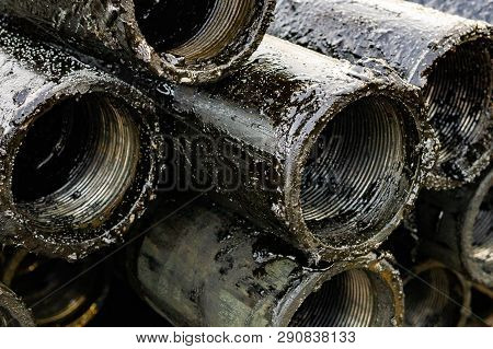 Oil Drill Pipe. Rusty Drill Pipes Were Drilled In The Well Section. Downhole Drilling Rig. Laying Th