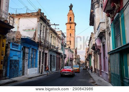 Havana, Cuba - 03/28/2018: The Red Retrocar Goes Through The Old Quarter Of Havana.