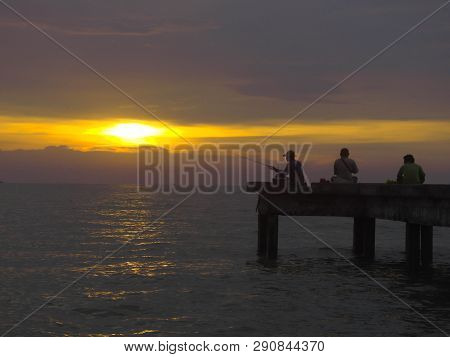 Port Dickson, Malaysia September 14, 2018 :  Jetty And Unidentified People Closeup During Sunset At 