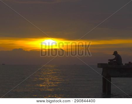 Port Dickson, Malaysia September 14, 2018 :  Jetty And Unidentified People Closeup During Sunset At 