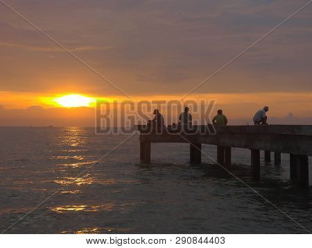Port Dickson, Malaysia September 14, 2018 :  Jetty And Unidentified People Closeup During Sunset At 