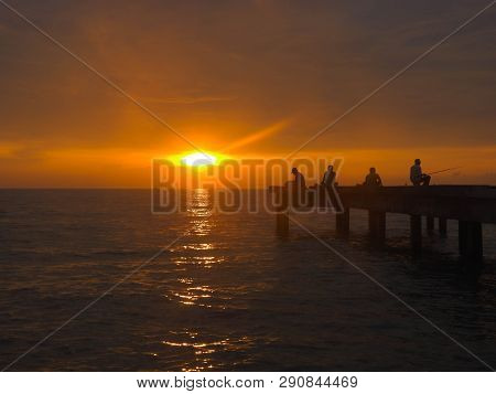 Port Dickson, Malaysia September 14, 2018 :  Jetty And Unidentified People Closeup During Sunset At 