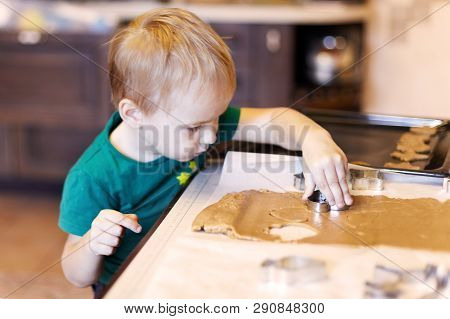 Cute Caucasian Baby Boy Helps In Kitchen, Making Homemade Coockies. Casual Lifestyle In Home Interio