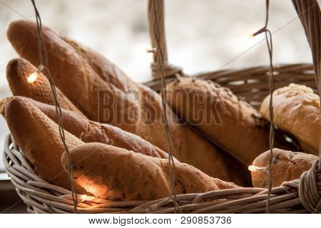 Delicious Fresh Baguette In The Basket Near The Window