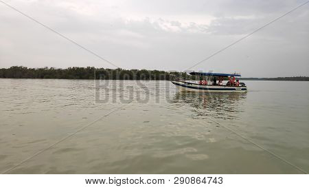 Kuala Selangor, Malaysia- 10 Mar, 2019: Tourists Enjoy The Eagles Feeding In A Boat At Kuala Selango