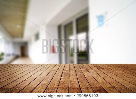 Wooden Brown Table Top Against The Blurred Corridor, Passage And Courtyard Of The House .for Product