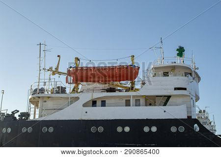 Orange Rescue Boat On The Cargo Vessel