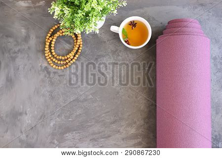 Rolled Yoga Mat With Mala Beads And Ayurveda Tea For Relax Yoga Practice Y Meditation.