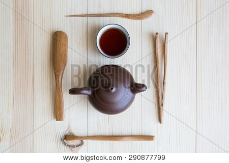 A Set Accessories For The Tea Ceremony. Dishes For Tea And Wooden Sticks On A Light Background