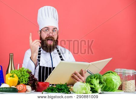Man Bearded Chef Cooking Food. Culinary Arts Concept. Amateur Cook Read Book Recipes. Man Learn Reci