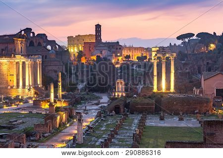 Ancient Ruins Of A Roman Forum Or Foro Romano, Colosseum Or Coliseum At Sunsrise In Rome, Italy. Vie