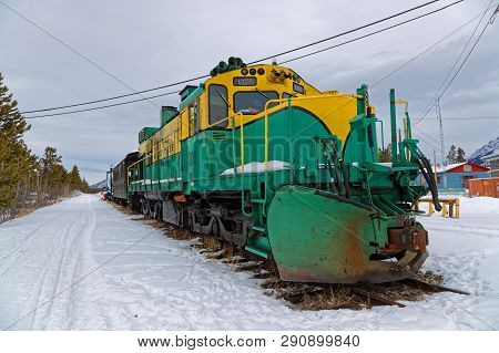 Carcross, Yukon, Canada, March 9, 2019 : An Old Locomotive In The Snow. Carcross Is An Unincorporate