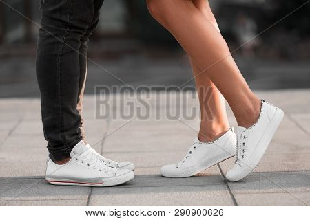 Male And Female Legs During Date, Couple Kissing At City Street, Side View